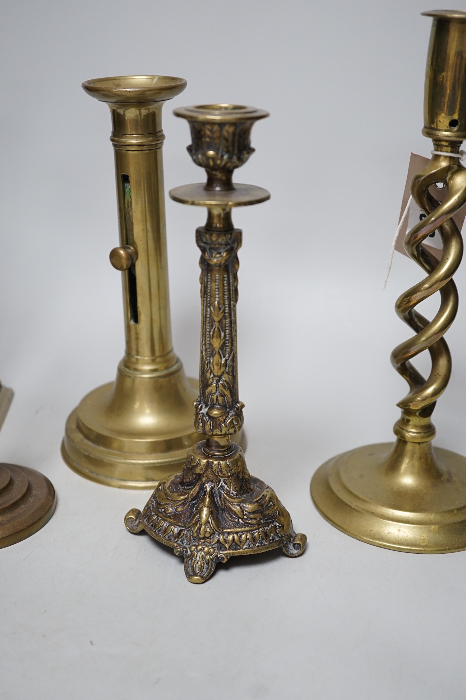 Five various brass candlesticks, tallest 26cms high